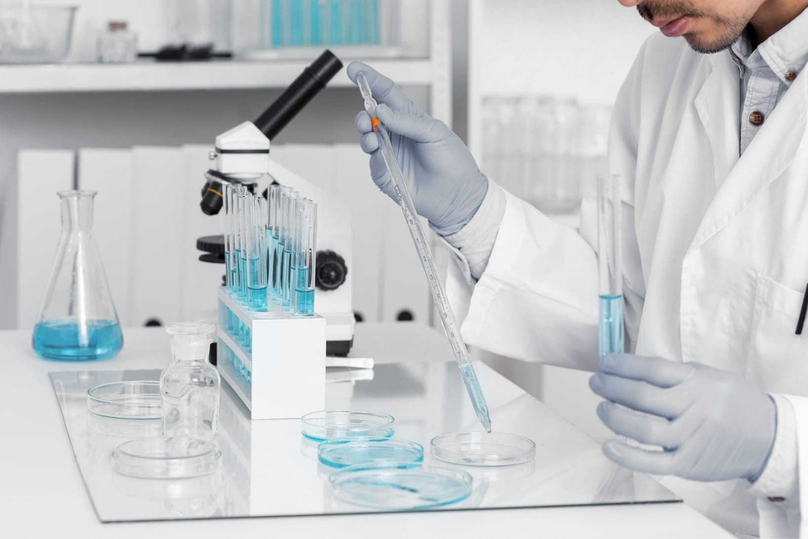 Researcher pipetting samples in a laboratory