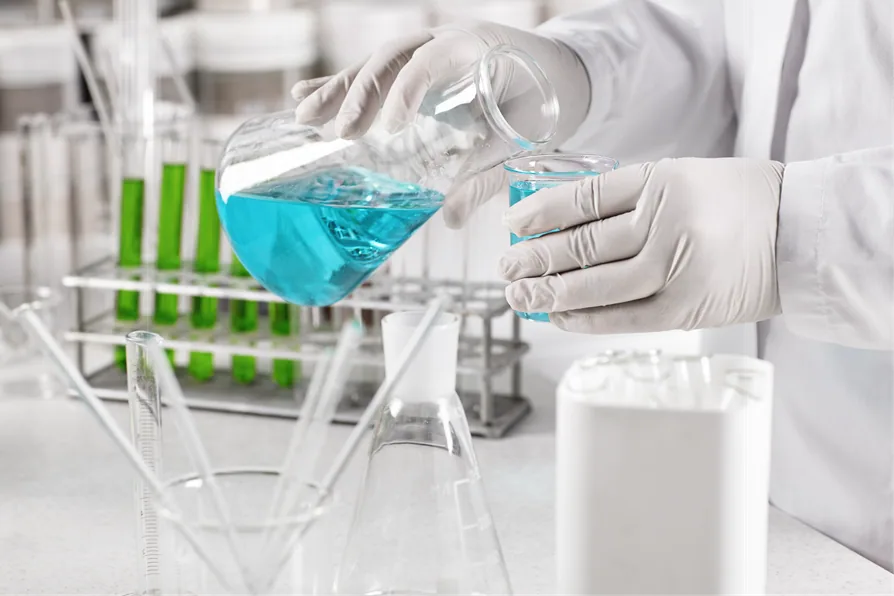 Pouring a solution into a beaker